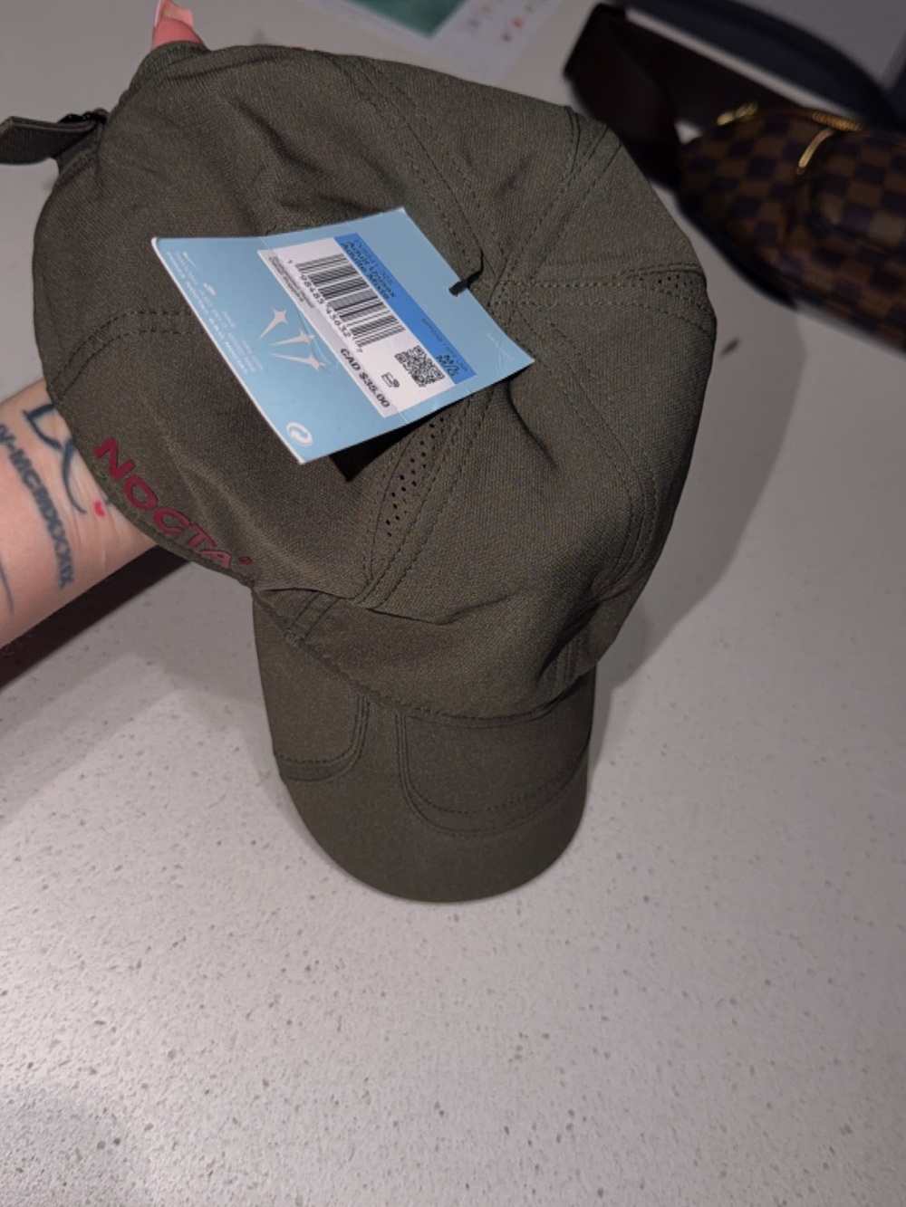 Nike Olive Green Baseball Cap with Visible Tag